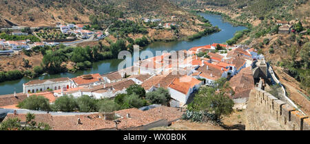 Panoramic view of Guadiana river bend and residential houses of Mertola city on the ripe. Portugal Stock Photo