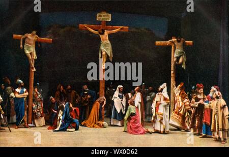 The Crucifixion, 1922. Players in the Oberammergau Passion Play. The play is performed every 10 years, on open-air stages, by the inhabitants of the village of Oberammergau in Bavaria, Germany. First staged in 1634, the play tells the story of Jesus' passion, culminating in his crucifixion. The event has become a tourist attraction, with audiences coming from all over the world. Official postcard of the 1922 Oberammergau Passion Play. [F. Bruckmann, Munich, Germany, 1922] Stock Photo