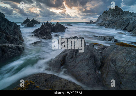 Stormy sunset over the dramatic North Devon coast, Devon, England, United Kingdom, Europe Stock Photo