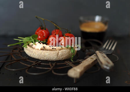 toast roll with cream cheese, rocket and tomatos Stock Photo