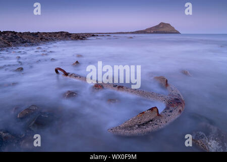 Rusted anchor from a shipwreck near Worm's Head on the Gower, Wales, United Kingdom, Europe Stock Photo