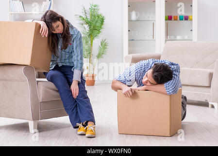 Young family moving in to new apartment after paying off mortgage Stock Photo