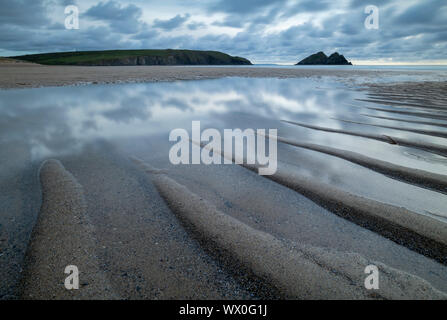Tidal pools on the sandy beach at Holywell Bay, Cornwall, England, United Kingdom, Europe Stock Photo