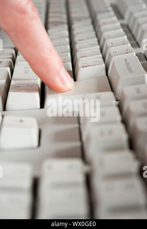 Fingers type a text on the computer keyboard Stock Photo