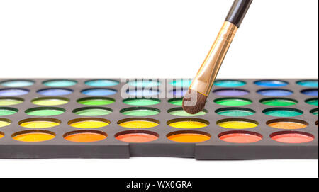 Set of Multicolored Eyeshadows with Brush, closeup Stock Photo