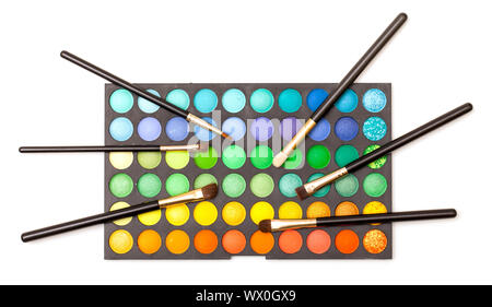 Set of Multicolored Eyeshadows with Brushes, closeup Stock Photo
