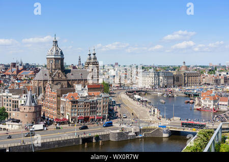 High angle view of central Amsterdam with St. Nicholas Church and tower, Amsterdam, North Holland, The Netherlands, Europe Stock Photo