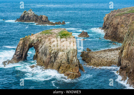 Enys Dodnan and the Armed Knight rock formations at Lands End, Cornwall, England, United Kingdom, Europe Stock Photo