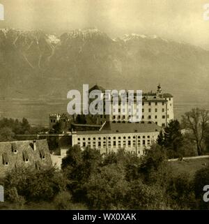 Ambras Castle, Innsbruck, Tyrol, Austria, c1935. View of Schloss Ambras, a Renaissance castle and palace in the hills above Innsbruck. It was built in the 16th century, and served as his family residence of Archduke Ferdinand II from 1567 to 1595. From &quot;&#xd6;sterreich - Land Und Volk&quot;, (Austria, Land and People). [R. Lechner (Wilhelm M&#xfc;ller), Vienna, c1935] Stock Photo