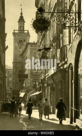 Judengasse, Salzburg, Austria, c1935. View of the bell tower of the town hall, from the narrow shopping street of Judengasse (Jews' Alley). From &quot;&#xd6;sterreich - Land Und Volk&quot;, (Austria, Land and People). [R. Lechner (Wilhelm M&#xfc;ller), Vienna, c1935] Stock Photo