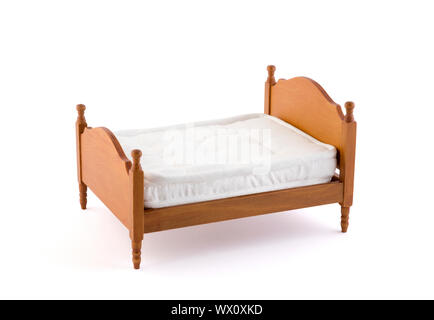 Wooden bed miniature on white background with clipping path Stock Photo