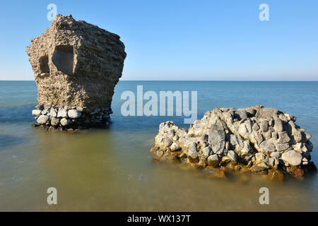 Ruins of bunker on the beach of the Baltic sea, part of an old fort in the former Soviet base Karosta in Liepaja, Latvia Stock Photo