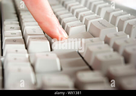 Fingers type a text on the computer keyboard Stock Photo