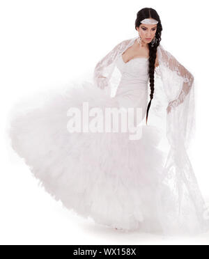 Young brunette dancing bride in white gown at white background Stock Photo