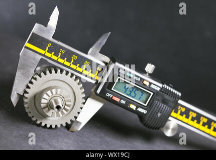 measurement  parameters of gears, details by digital micrometer Stock Photo