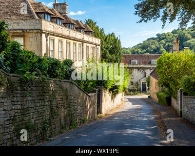 Small manor house and other grand buildings on a street in Freshford village near Bath in Somerset UK Stock Photo