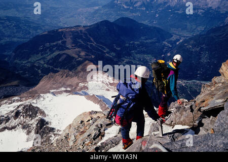 Climbers high on the Gouter Ridge on Mont Blanc, Chamonix, France Stock Photo