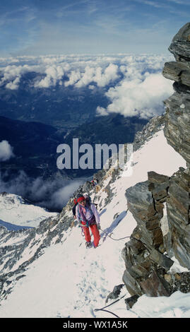 Climbers high on the Gouter Ridge on Mont Blanc, Chamonix, France Stock Photo