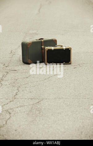 A Old Suitcase  beside the Road. Stock Photo