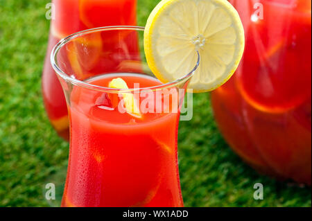 Chilled Orange Lemon Sangria in a summer setting Stock Photo