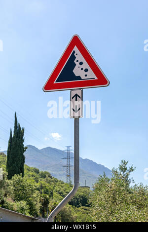 Falling Stones and Rocks Traffic Sign at Pole Stock Photo