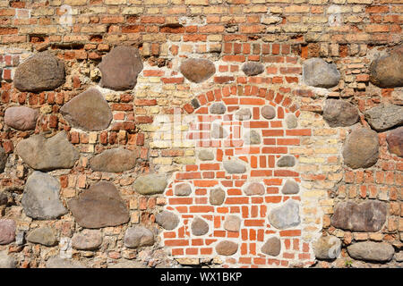 Closeup view of old wall of medieval castle made of red bricks and ...