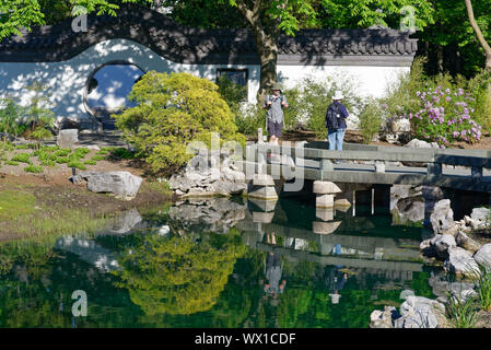 The Chinese Garden in Montreal Botanical Garden with the Olympic Stadium tower beyond Stock Photo