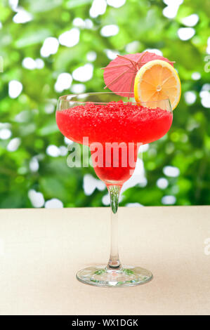 Strawberry Watermelon Daiquiri decorated with lemon and umbrella Stock Photo