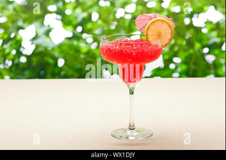 Strawberry Watermelon Daiquiri decorated with lemon and umbrella Stock Photo