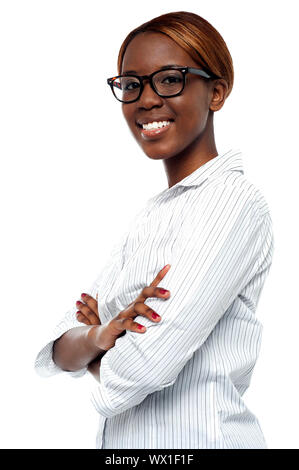 Side view of confident corporate lady posing in style with her arms crossed Stock Photo