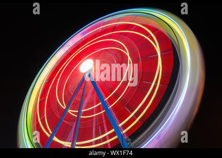 Beutiful Long exposure picture of a ferris wheel rotating Stock Photo