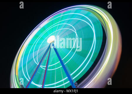 Beutiful Long exposure picture of a ferris wheel rotating Stock Photo