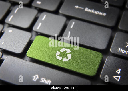 Go green key with wind turbine icon on laptop keyboard. Included clipping path, so you can easily edit it. Stock Photo