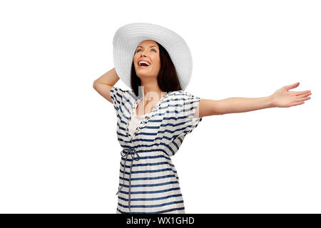 young woman in striped tunic and sun hat Stock Photo
