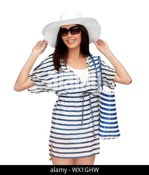 young woman in striped tunic and sun hat Stock Photo