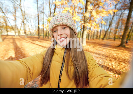 happy girl taking selfie at autumn park Stock Photo
