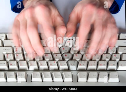 Fingers type a text on the computer keyboard Stock Photo