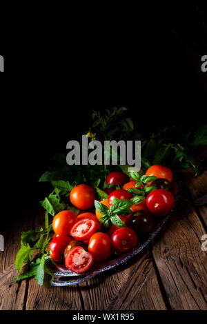 various types of tomatoes served and presented on the silver platter. Stock Photo