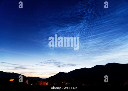 Noctilucent clouds over Skiddaw in the Lake District, Cumbria, UK Stock Photo