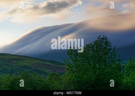 A loud cap moving across the summir of Skiddaw in the Lake District, Cumbria, UK Stock Photo