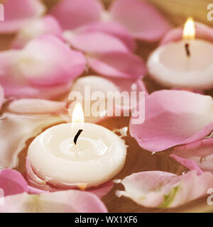 Spa Floating Candles And Rose Petals In Water Stock Photo