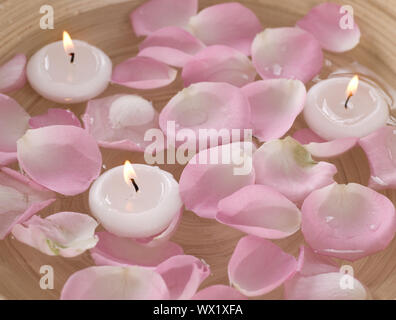 Spa Floating Candles And Rose Petals In Water Stock Photo