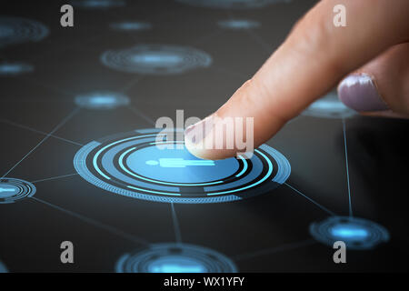 finger touching network icon on interactive panel Stock Photo