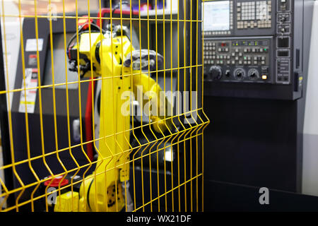 Automated robotic cell which includes CNC machining center and collaborative robot. Stock Photo