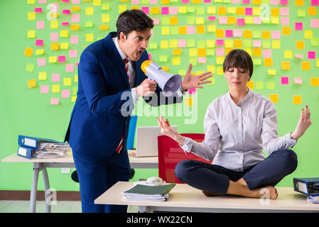 Businesswoman under stress in office Stock Photo