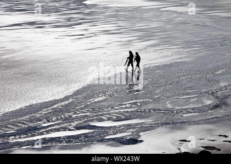 two people in mudflats, Vallnavik, Snæfellsnes, Vesturland, Iceland, Europe Stock Photo