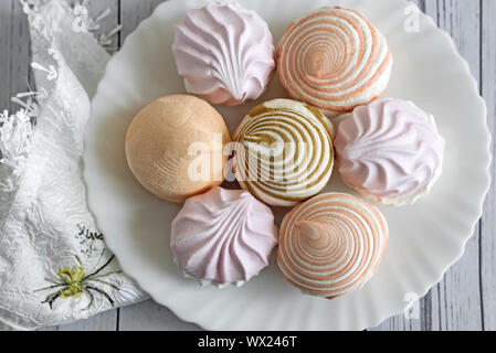 Marshmallows of different varieties on a plate. Stock Photo