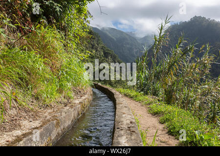 Levada, irrigation canal with hiking path at Madeira Island, Portugal Stock Photo