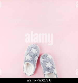 Sleep. Soft fluffy slippers on pink background. Creative conceptual top view flat lay in minimal style. Rest, good night, insomnia, relaxation, tired, Stock Photo