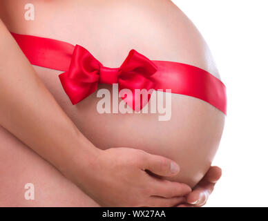 Pregnant Belly with Gift Bow. Pregnancy Stock Photo